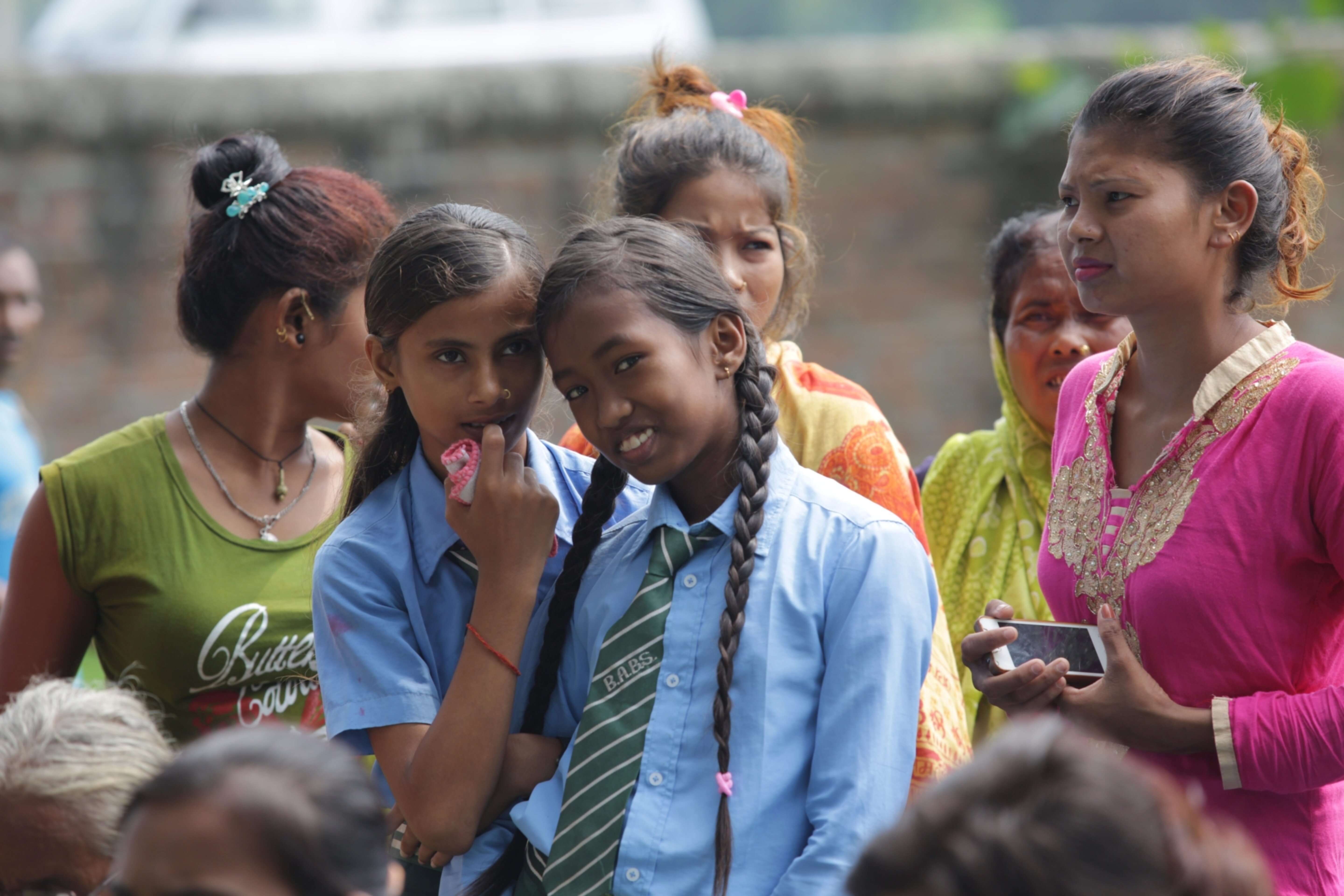 A group of adolescent girls listen to an awareness session